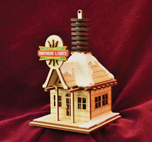 Load image into Gallery viewer, GINGER COTTAGES NORTHERN LIGHTS ELECTRIC COMPANY XMAS ORNAMENT MADE IN USA GC134
