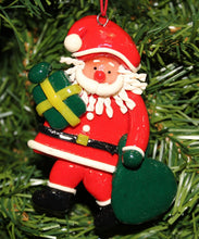 Load image into Gallery viewer, KURT ADLER VINTAGE 1990's CLAY DOUGH SANTA CLAUS HOLDING GIFT CHRISTMAS ORNAMENT
