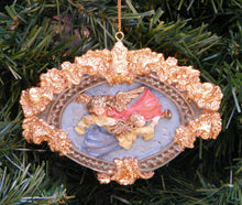 Load image into Gallery viewer, KURT ADLER VINTAGE 90's HERALD ANGELS IN GOLD OVAL ART FRAME CHRISTMAS ORNAMENT
